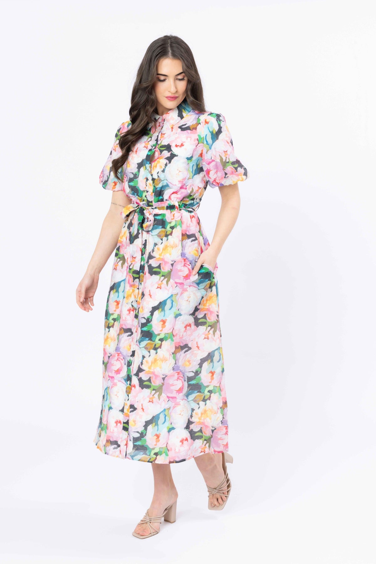 Woman wearing a floral dress on a white background